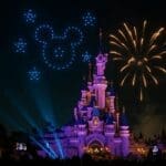 Disney Tales of Magic nighttime show at Disneyland Paris with drones forming Mickey and fireworks above Sleeping Beauty Castle.