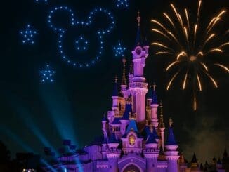 Disney Tales of Magic nighttime show at Disneyland Paris with drones forming Mickey and fireworks above Sleeping Beauty Castle.
