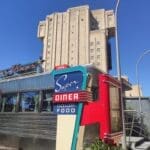 Exterior of Super Diner with neon signage in Avengers Campus