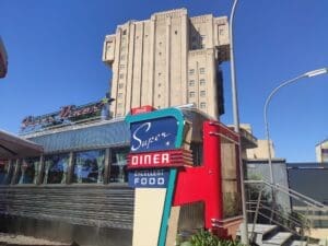 Exterior of Super Diner with neon signage in Avengers Campus