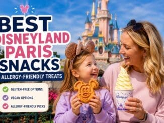 Mother and daughter enjoying a Mickey waffle and soft serve ice cream in front of Disneyland Paris Castle, highlighting the best snacks and allergy-friendly treats at Disneyland Paris.