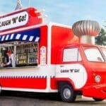 Laugh ‘n’ Go! food truck in Avengers Campus at Disneyland Paris with yellow cartoon cheese wedge design
