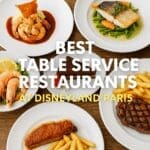Selection of Disneyland Paris table service meals including steak, fish, shrimp, and chocolate dessert on white plates with rustic wooden background