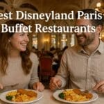A smiling couple enjoying a buffet meal in an elegant, Victorian-style Disneyland Paris restaurant, with the text “Best Disneyland Paris Buffet Restaurants” displayed