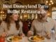 A smiling couple enjoying a buffet meal in an elegant, Victorian-style Disneyland Paris restaurant, with the text “Best Disneyland Paris Buffet Restaurants” displayed