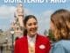 Friendly Disneyland Paris Cast Member speaking to guests in English
