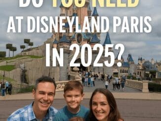 Family at Disneyland Paris looking at a park map with Sleeping Beauty Castle in the background