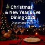 Festive dining table with Sleeping Beauty Castle lit up for Christmas and New Year’s Eve 2025 at Disneyland Paris.