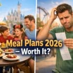 Family enjoying food at a theme park restaurant while another guest looks confused at a receipt, representing Disneyland Paris meal plans 2026 comparison