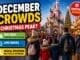 Disneyland Paris December crowds guide with festive Christmas decorations, busy holiday crowds, family walking toward castle and winter season atmosphere