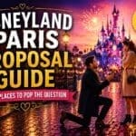 Romantic Disneyland Paris proposal at sunset with couple beside fairytale castle, fireworks, lanterns and magical evening atmosphere