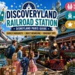 Discoveryland Railroad Station at Disneyland Paris with a steam train arriving in a retro-futuristic setting as families board the Disneyland Railroad